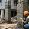 Column jacketing work restoring damaged RCC building structure through structural strengthening and repair